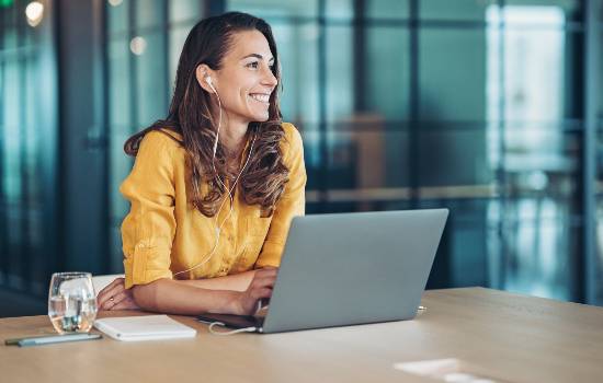 woman in office on laptop Canon business centre SOS site