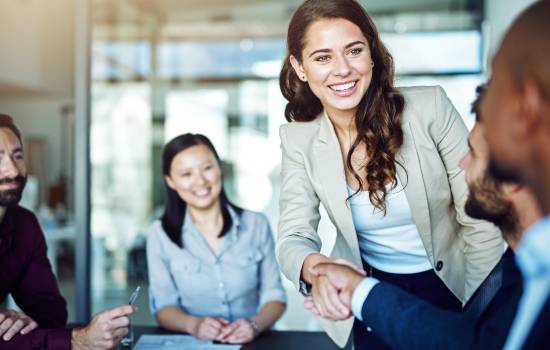 woman shaking hands using document management software